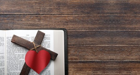 Holy Bible book on the table with Cross and heart
