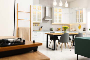 Spring atmosphere. Stylish kitchen interior with comfortable furniture