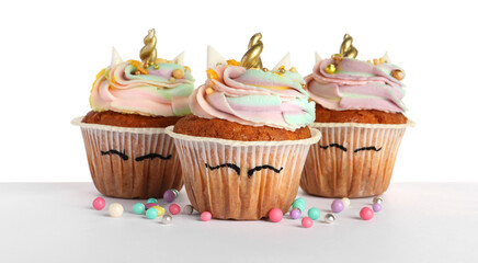 Cute sweet unicorn cupcakes isolated on white