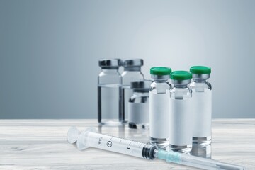 Bottles of medical vaccine for virus vaccination.