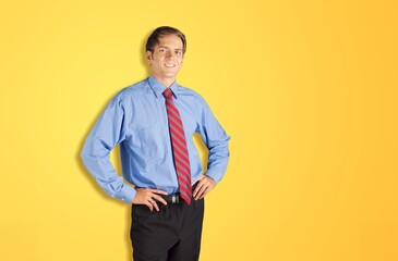 Young attractive man posing on background