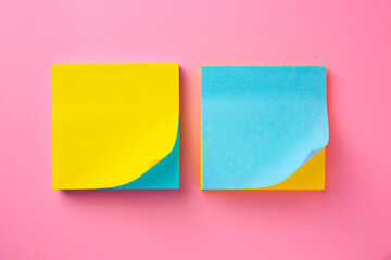 Blank paper notes on pink background, flat lay