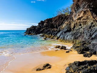 Fototapeta na wymiar Lava Rocks and Sand on Big Beach, Makena State Park, Maui, Hawaii, USA