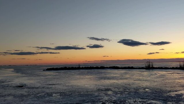 Frozen lake view at sun set time in Michigan