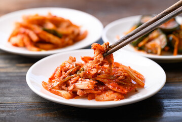 Kimchi cabbage, radish and cucumber ready to eating on wooden table, Korean food homemade side dish
