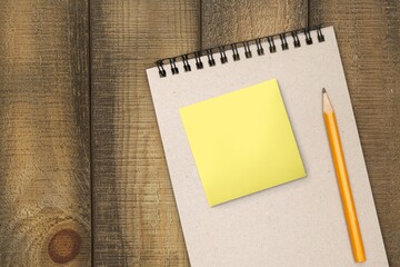 Blank sticky notes on notebook and pen
