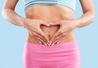 Healthy stomach, woman hands on belly