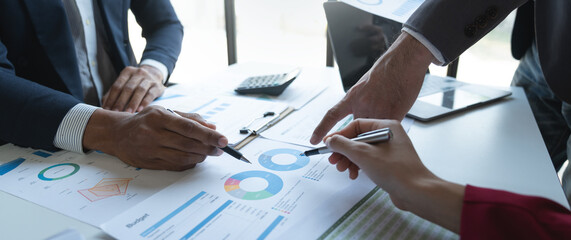 Asian entrepreneurs and businessmen meet in the office for business planning and financial budgets and assess investment risks To analyze customer groups to increase the growth of the company.
