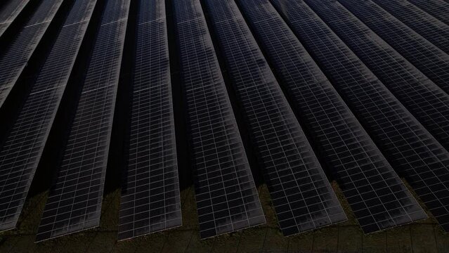 Frozen solar panels aerial reveal of single turbine windmill in The Netherlands part of sustainable industry in Dutch river IJssel landscape near Zutphen. Aerial circular economy concept.