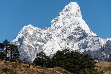 Tourist standing on the hill and looking to beautiful view of Mt.Ama Dablam (6,812 m). Ama Dablam is one of the most beautiful mountains in the world.