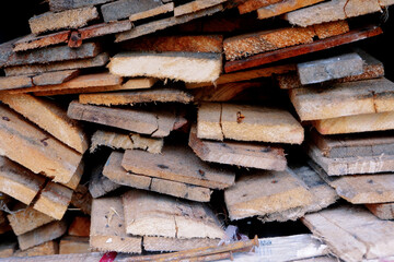 stacks of used wooden planks
