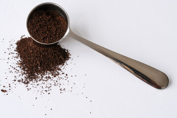 Ground Coffee Beans Spilled from a Scoop