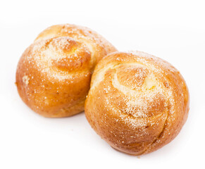 sweet hot roll with raisins on a white background.