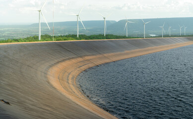 HDPE plastic lined water reservoirs and landscape of wind farm for power generating stations. High...