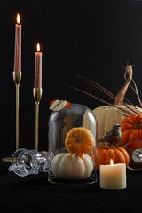 Halloween decoration in modern style. candles and pumpkins in the dark background. Photo zone for Halloween