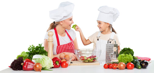 mother and daughter prepare salads