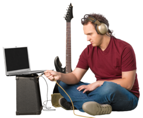 Young man with a guitar listening to music