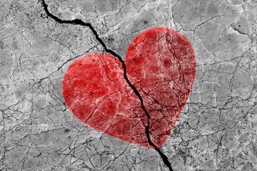 Shape of red heart on cracked texture