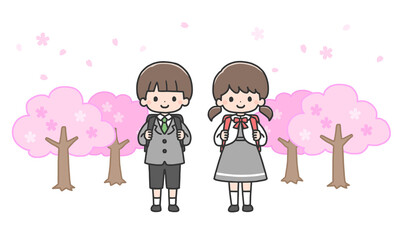 入学式　桜の前に立つ新一年生の男の子と女の子