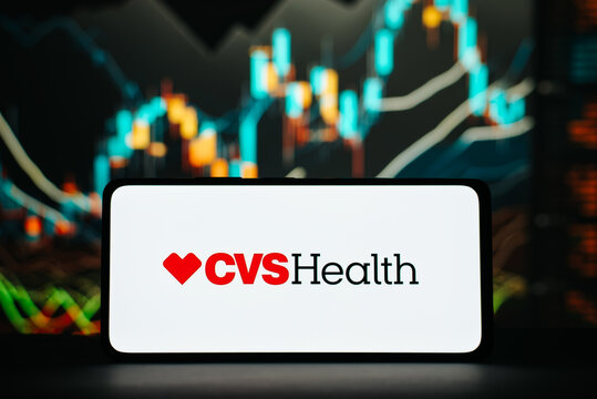 CVS Health and investment, financial business concept. CVS Health company logo on smartphone on background of stock chart trading view. Astana, Kazakhstan 20.02.2023