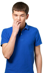 Young man standing a biting his nails