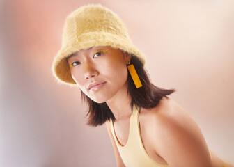 Asian woman, fashion and makeup with gen z and portrait, yellow aesthetic and edgy on studio background. Streetwear, beauty and cosmetics with style, female face and young model with fog or smoke