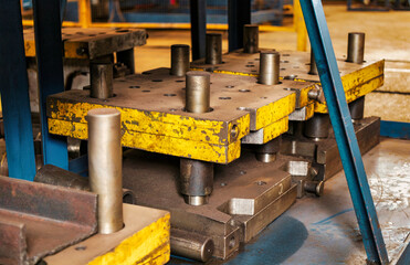 Forms for a hydraulic press on a rack. industrial metalworking machines. Close-up of hydraulic...