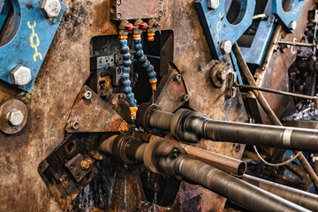 Machine for induction heating of metal. A metal rod heated in an induction furnace. Hot metal...