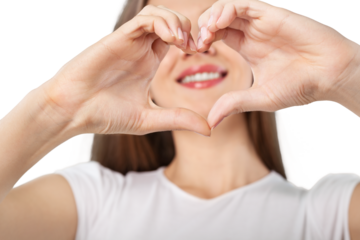 Portrait of beautiful young woman with heart shape