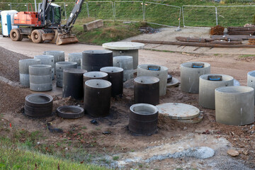 New  concrete rings for wells and sewer on construction  site