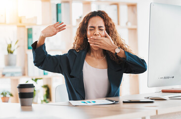 Tired, yawn and business woman at desk in office feeling exhausted, overworked and low energy....