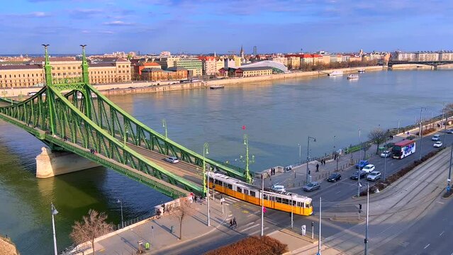 The yellow tram on the Liberty Bridge, top view, Budapest, Hungary