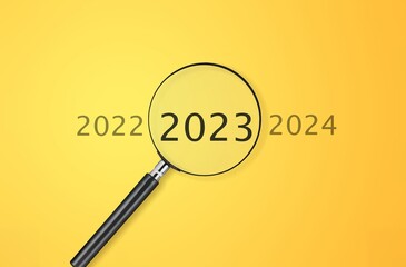 Magnifier glass with 2023 numbers on background