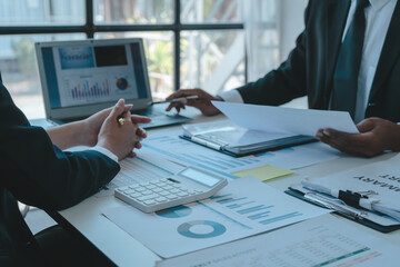 Close up accountant working on consolidated financial report of corporate operations, consultant auditing finance data (balance sheet, income statement) fintech.