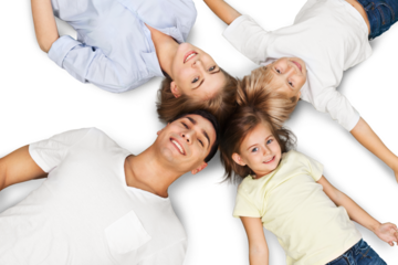 Portrait of happy family lying on floor in their new house