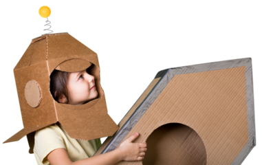 Child with rocket is dressed in an astronaut costume