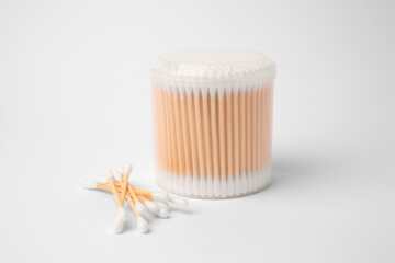 Fototapeta na wymiar Cotton buds in plastic container isolated on white