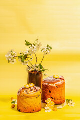 Easter cake Cruffin or sweet bread kulich. Traditional festive baking and blooming cherry branches