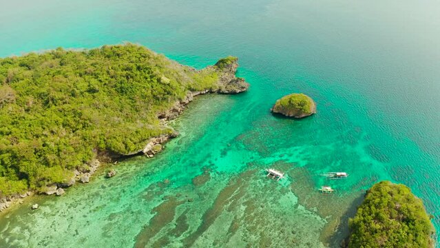 Turquoise lagoon with rocky island and corall reef, aerial view Boracay, Philippines. Summer and travel vacation concept.
