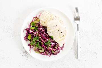 Steamed chicken breast and fresh vegetable red cabbage salad.