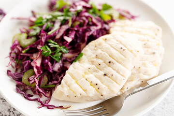 Steamed chicken breast and fresh vegetable red cabbage salad.