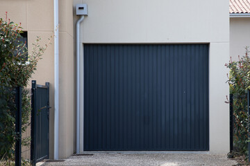 home Up-and-over garage gray door with vertical grooves gate access to house for car grey dark door