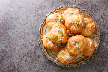 Closeup view of an appetizer garlic knots bread with parsley and parmesan cheese closeup on the...