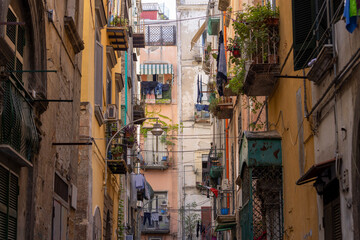Fototapeta na wymiar A typical Italian cityscape, colorful buildings, narrow street, Naples, Italy