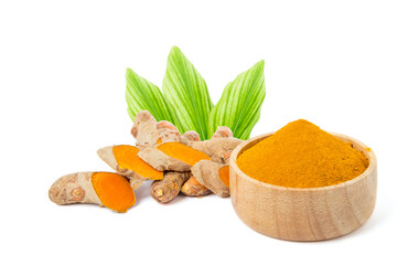 Fresh yellow turmeric powder in a wooden cup, sliced ​​fresh turmeric bulbs showing juicy flesh and fresh green leaves. isolated on white background.