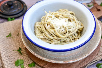  Black Truffle sauce fresh tagliolini noodle pasta, original italian food fresh egg pasta, cream sauce  and fresh herbs.Spaghetti with fresh black truffle and cream sauce