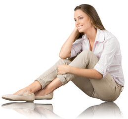 Portrait of a young  pretty woman sitting isolated on background