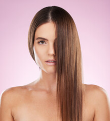 Fototapeta premium Hair, face and beauty and woman in portrait for haircare, skincare and keratin treatment on pink background. Cosmetics, grooming and hairstyle, dandruff free and makeup, female with healthy skin