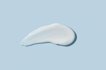 Poster Cosmetic product smear white moisturizing lotion isolated on blue, squeezed out and smeared portion of skincare cream product testing. © IKvyatkovskaya