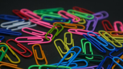 Paper clip isolated on a black background
